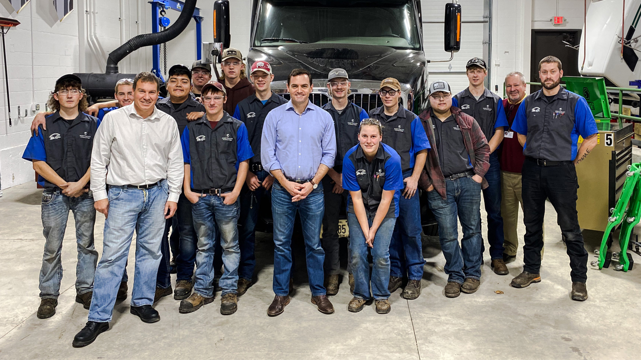 Congressman Mike Gallagher (center)  visits the center.