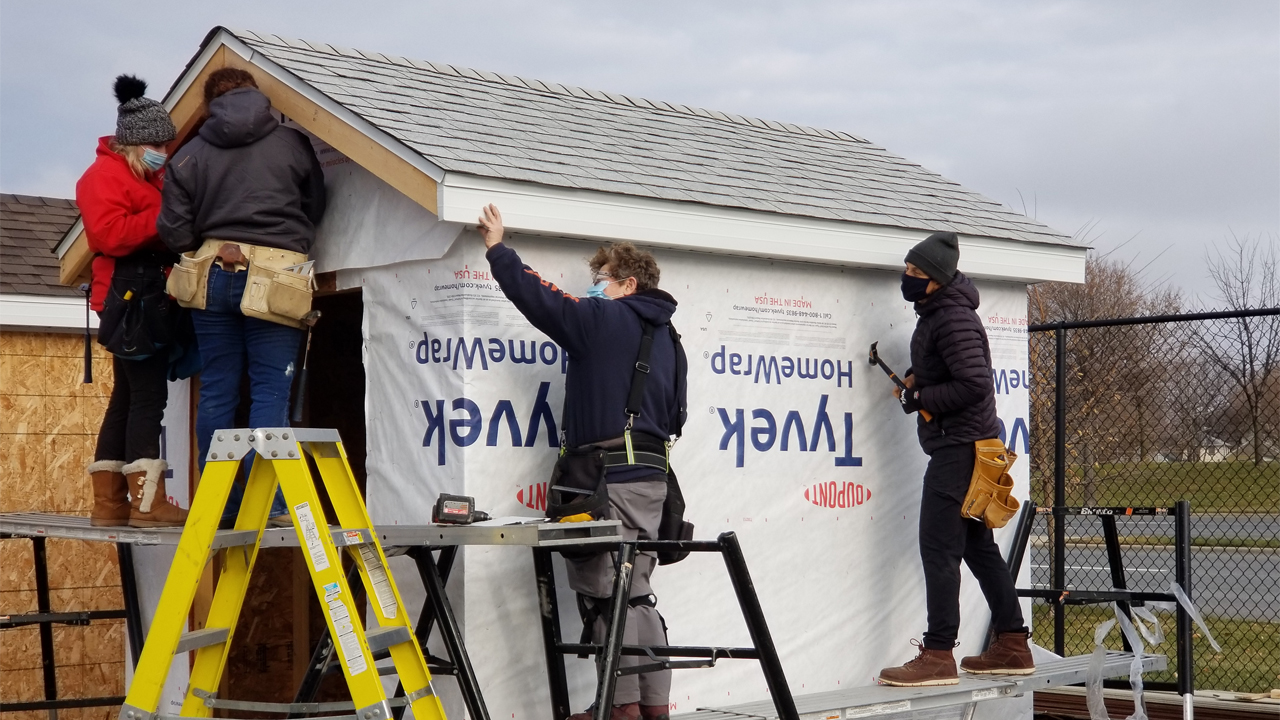 Students work on a tiny house.